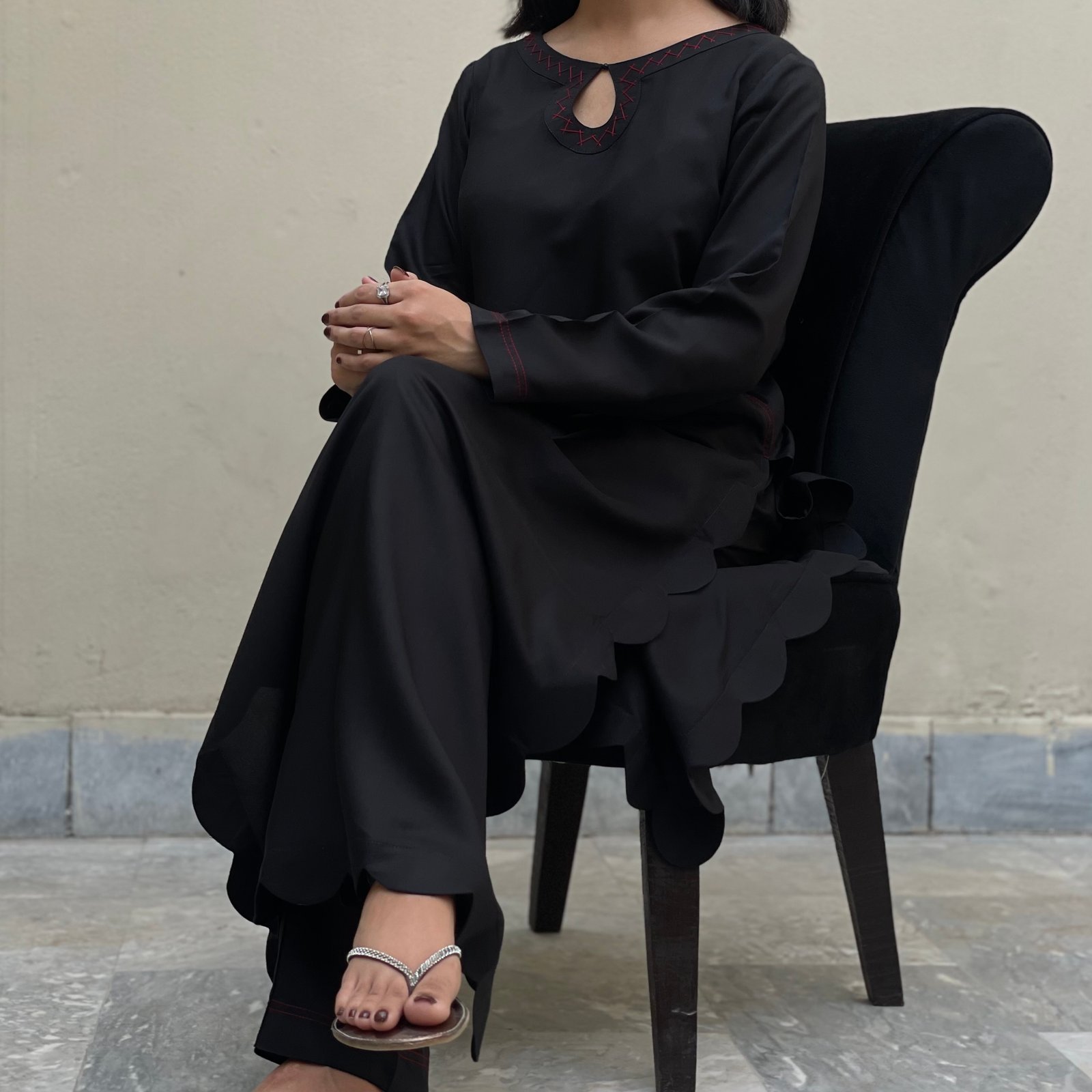 Khamosh Ada from The First Edit, a black two-piece set with contrast threadwork